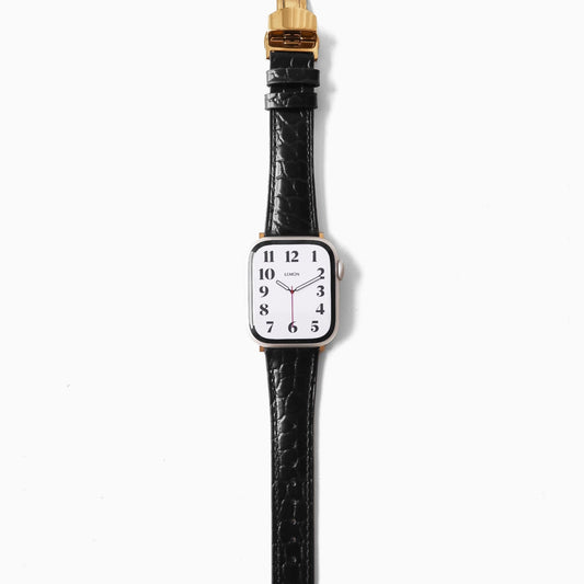 apple Watch black leather strap and gold accents