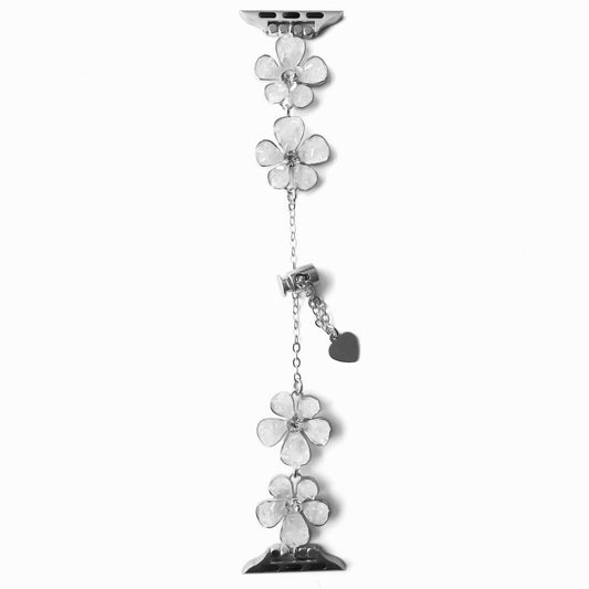 A silver bracelet with floral designs, designed for use with an Apple Watch.