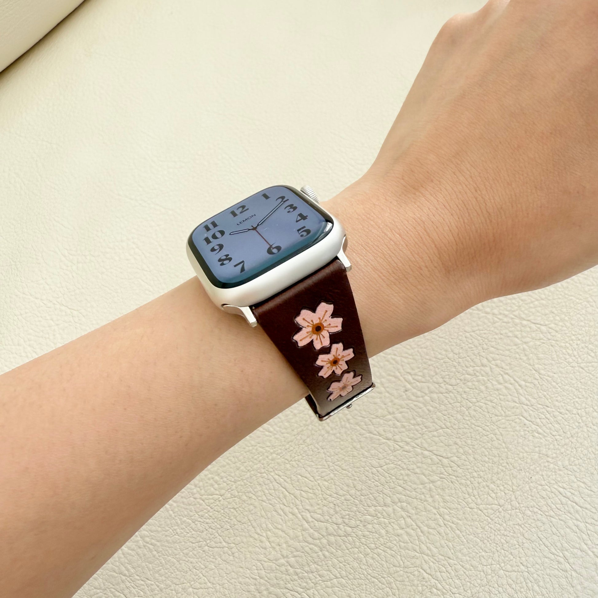 apple Smartwatch with a floral strap on a wrist women