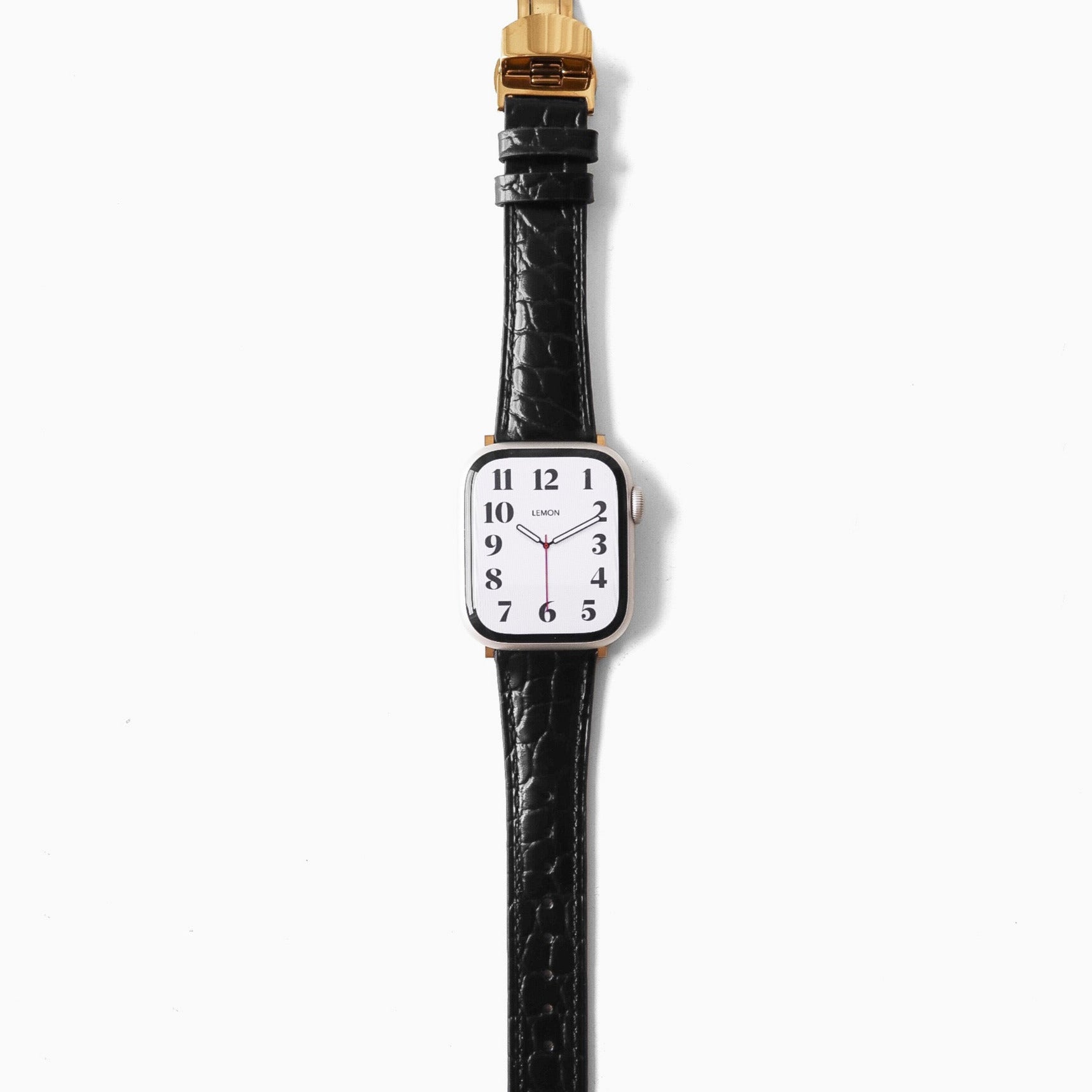 apple Watch black leather strap and gold accents