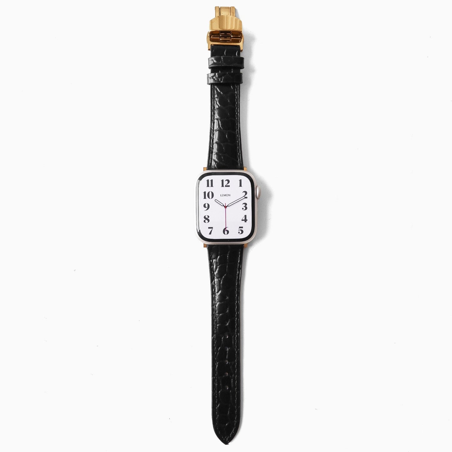 Watch with a black strap and gold accents on a white background