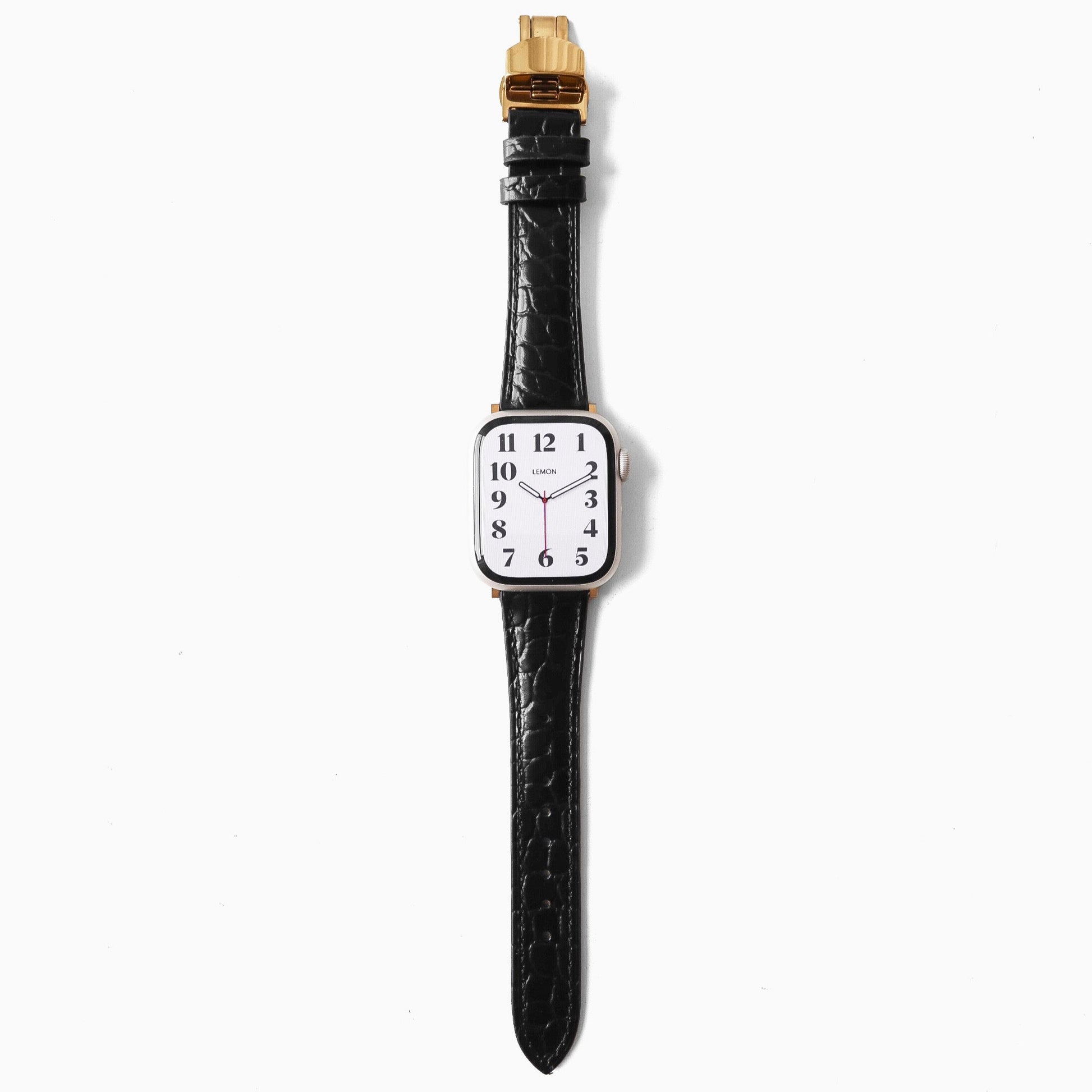 Watch with a black strap and gold accents on a white background