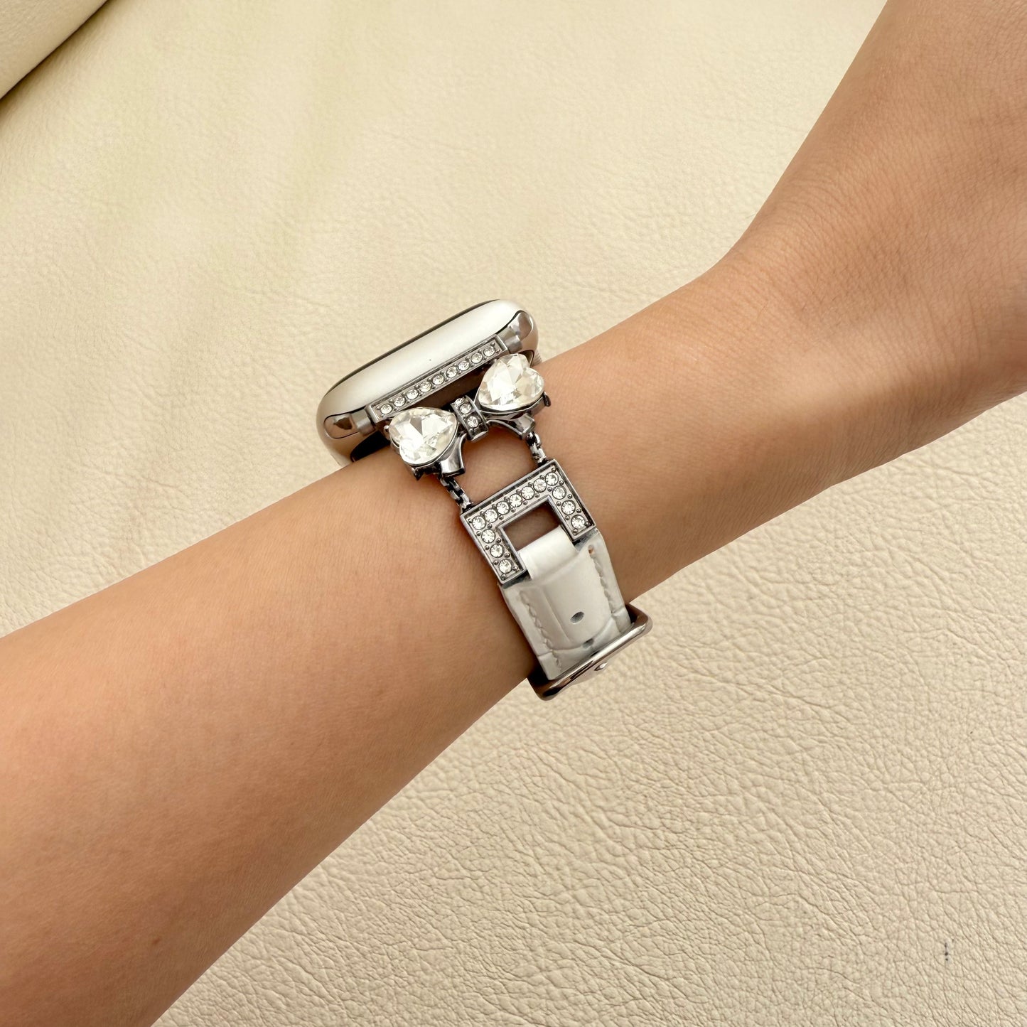 Silver bracelet with heart-shaped charms on a WOMEN WRIST