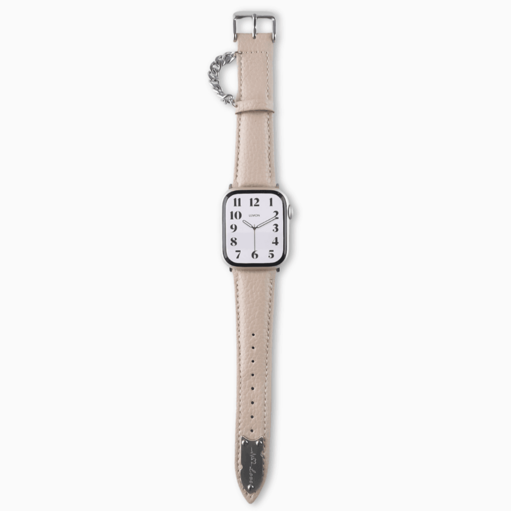 A beige leather watch band with a silver buckle, displayed on a APPLE watch.