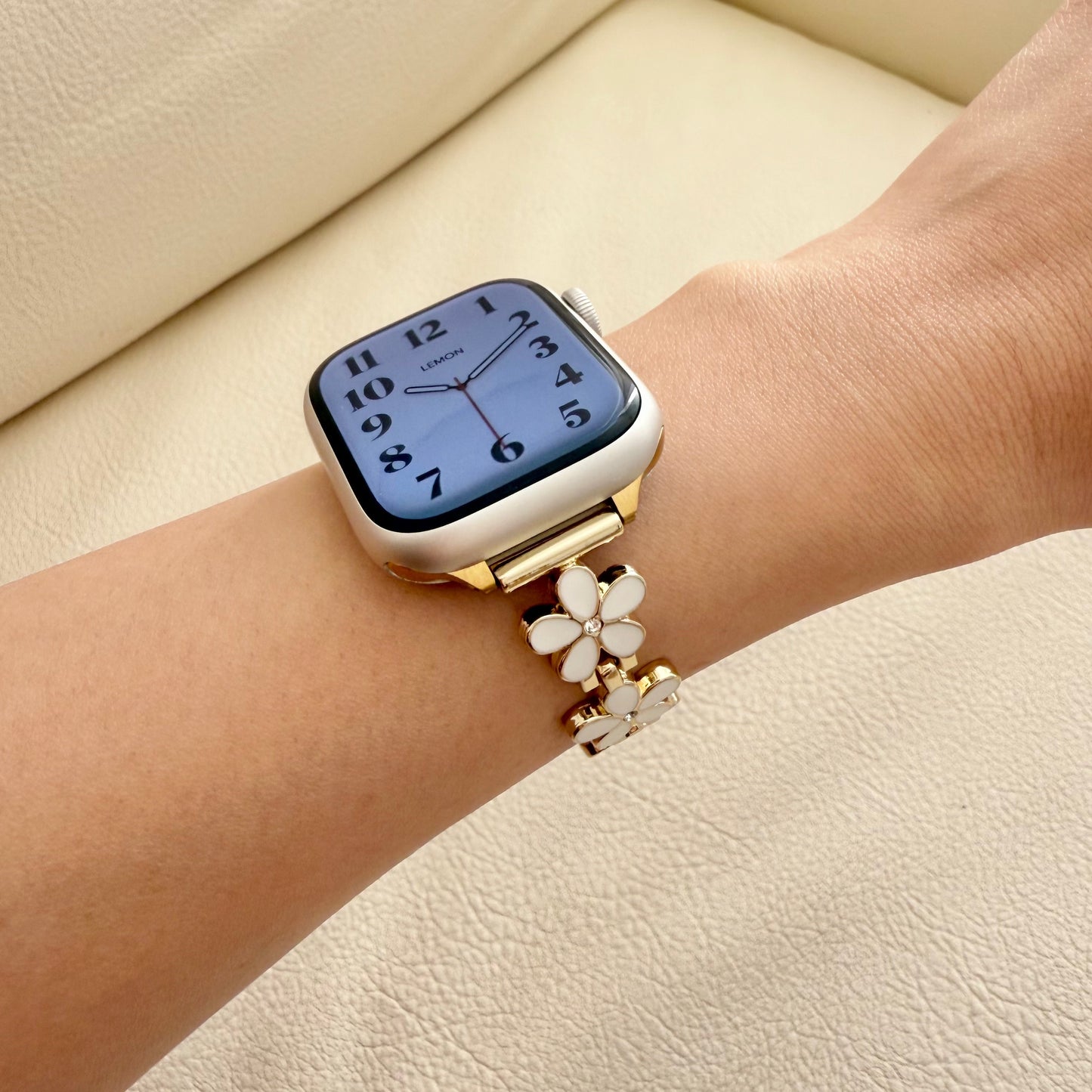 Decorative apple watch watch strap with floral design on wrist