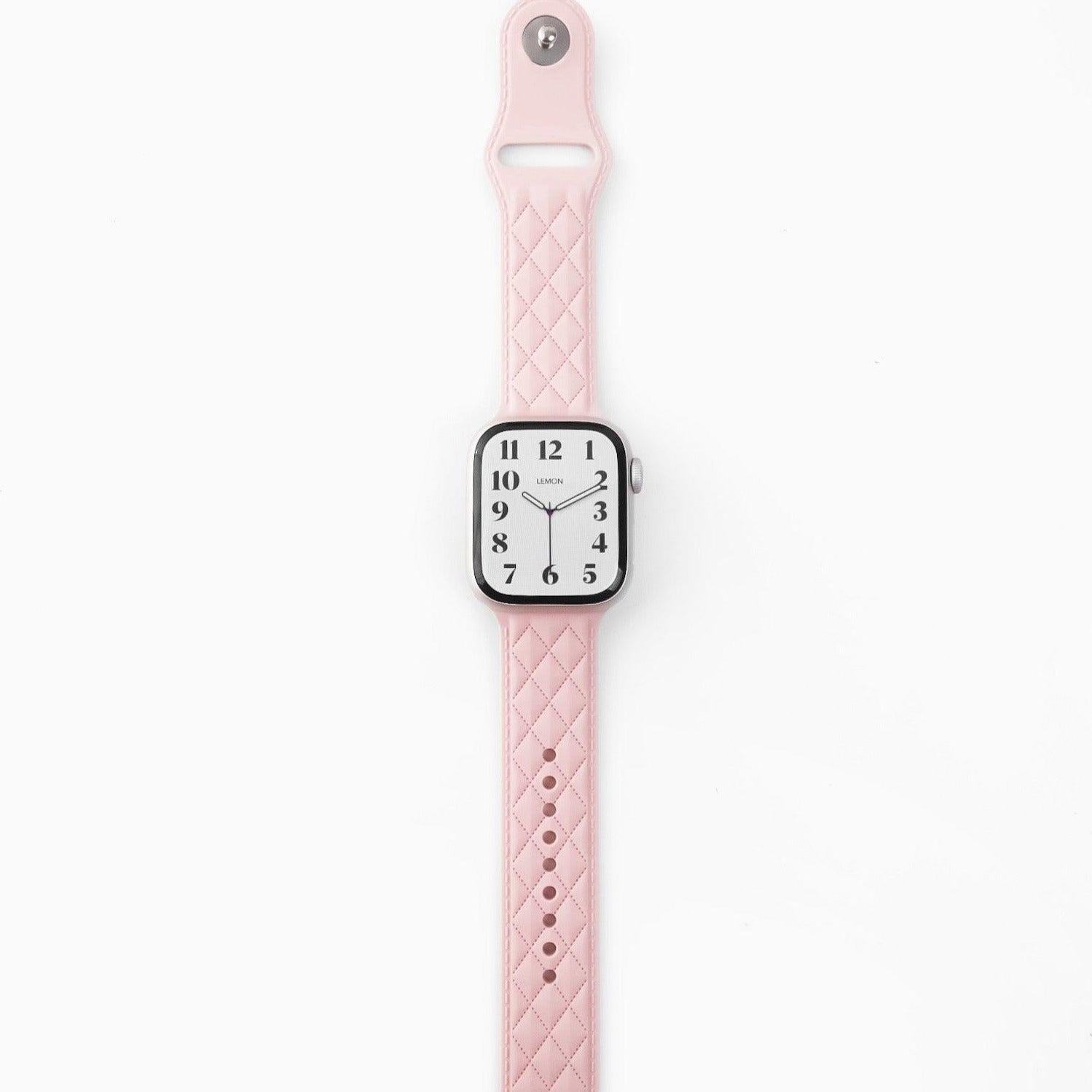 A pink lattice-patterned rubber band for Apple Watch.