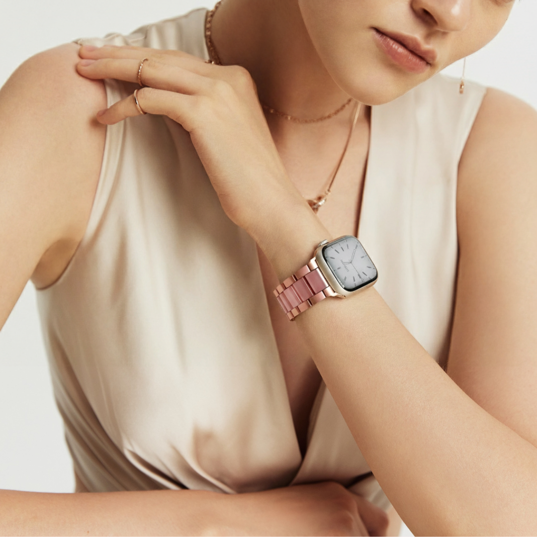 Woman wearinga watch with a pink apple watch strap 