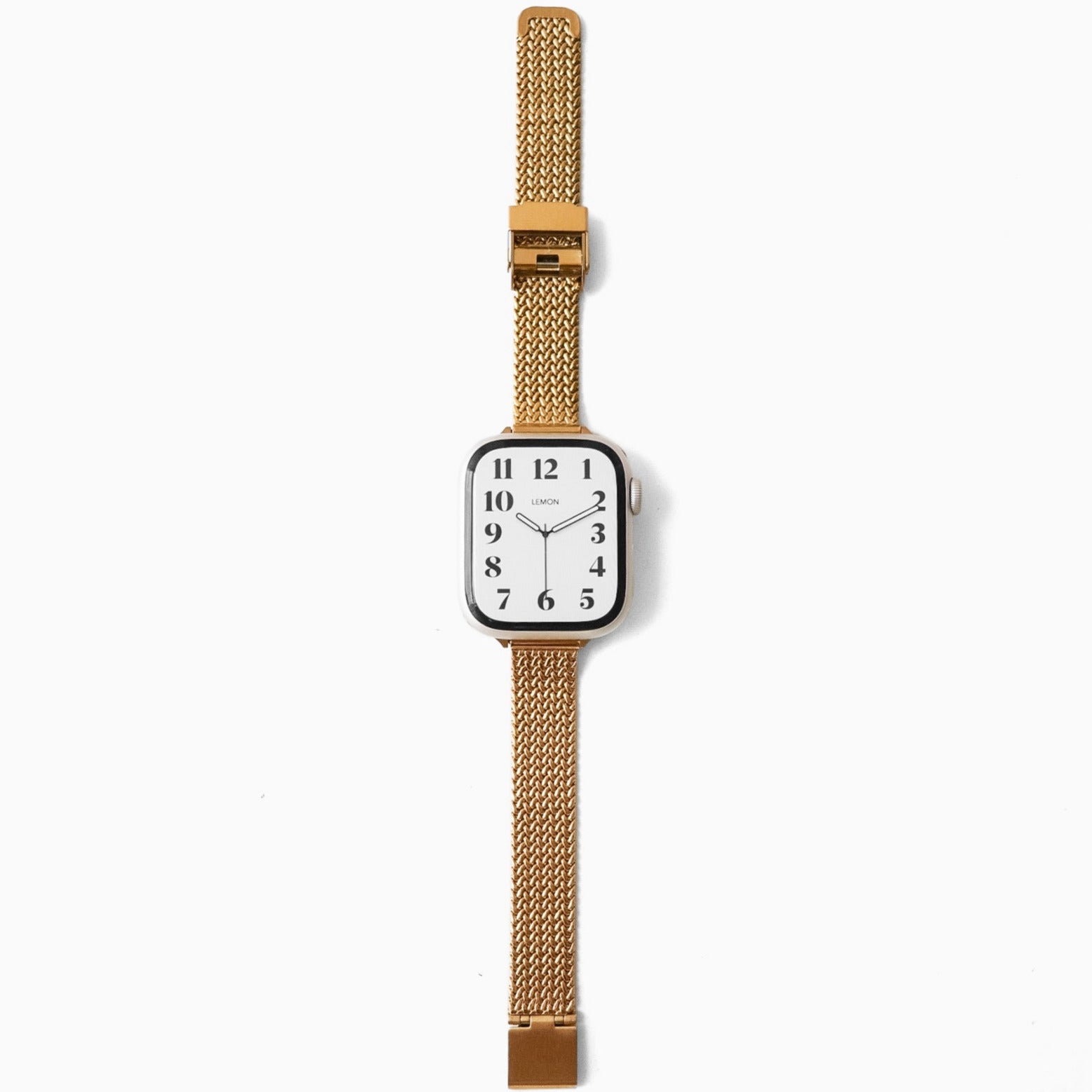 Watch with a gold mesh strap on a white background