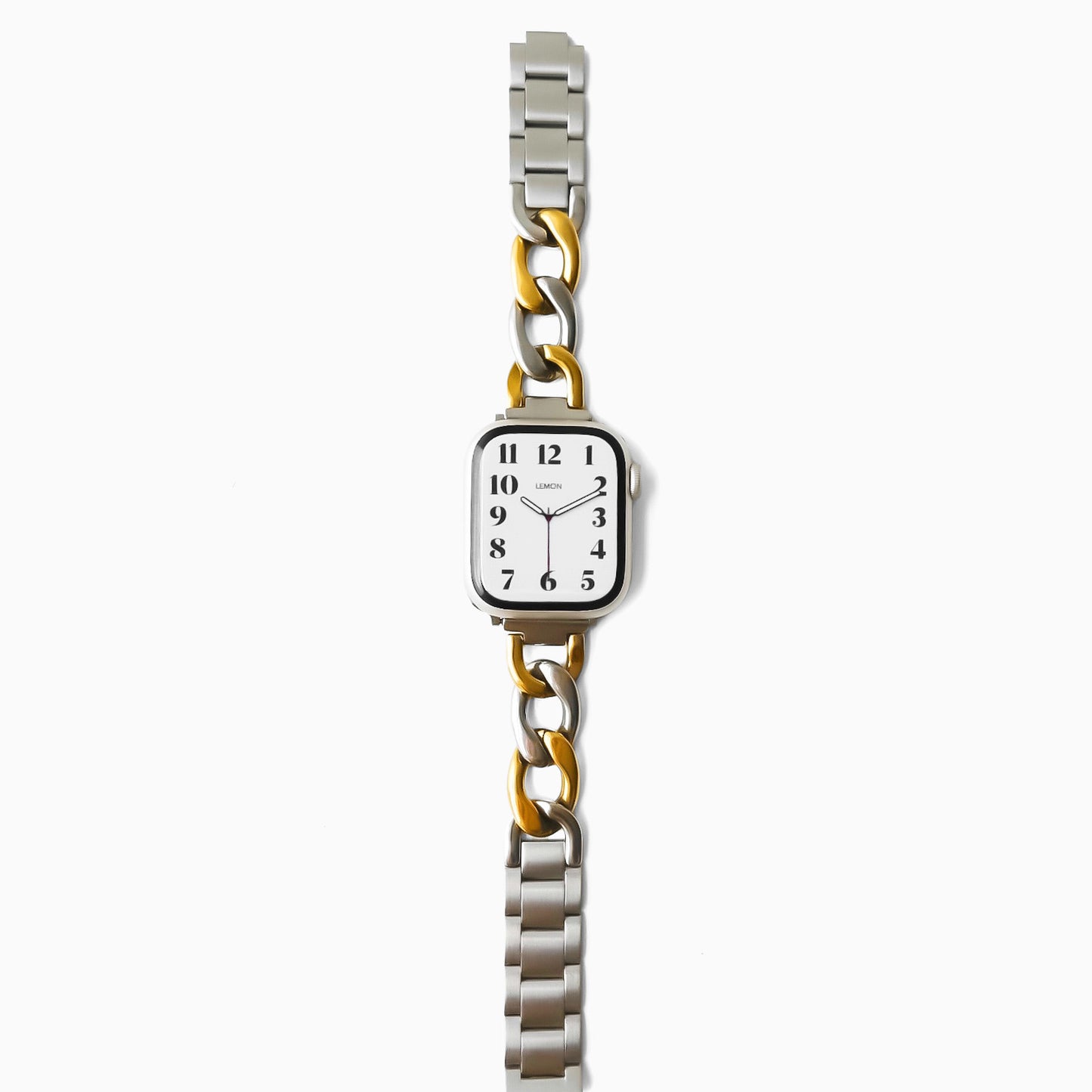 Wristwatch with a silver and gold metal band on a white background